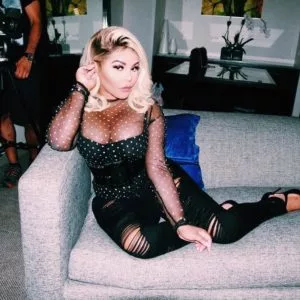 IG LilKim on a couch