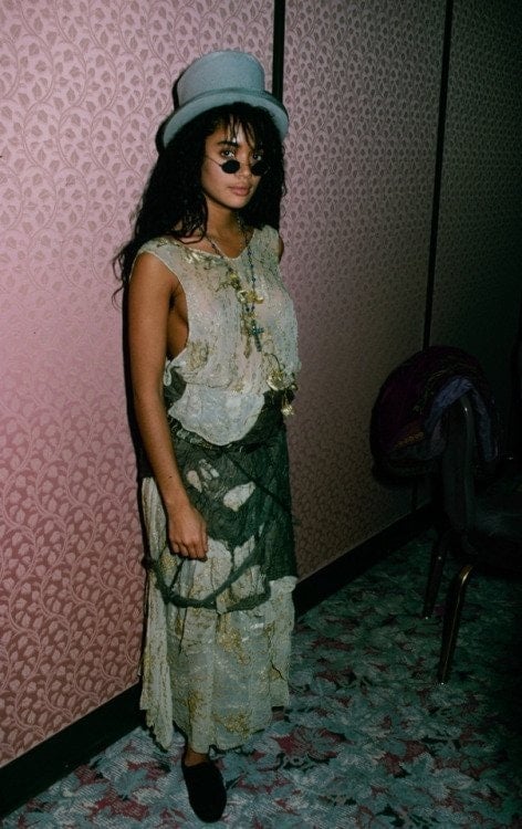 A young Lisa Bonet in boho chic skirt and hat
