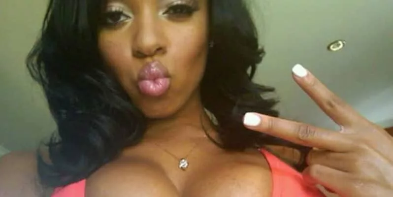 Sheneka Adams' nipple popping out peace sign
